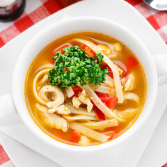 Bowl of delicious soup on a table