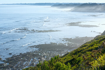 Obraz premium Morning ocean coast view from shore (near Saint-Jean-de-Luz, France, Bay of Biscay).