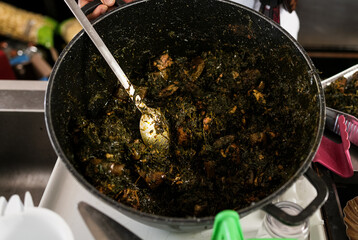 a pot of Eru, African food, ethnic food and African cuisine.