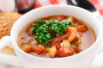 Bowl of delicious soup on a table