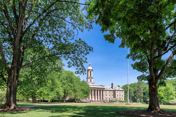 The campus of Pennsylvania State University, big trees in spring sunny day, State College, Pennsylvania.