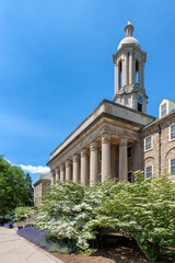 The Old Main building on the campus of Penn State University in spring sunny day, State College, Pennsylvania. - 617539734