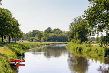 Fototapeten Summer landscape with view of Beneden Regge rivier in Ommen, Overijssel, The Pieterpad is a long distance walking route in the Netherlands, The trail runs from northern part of Groningen to Maastricht © Sarawut