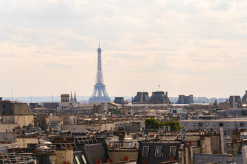 Mystical Elegance: The elegant Eiffel Tower Shrouded in a Foggy Parisian Ambience
