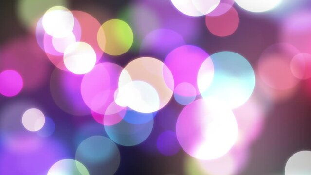 Abstract colorful motion background glowing rays bokeh particles. Seamless loopable animation background.