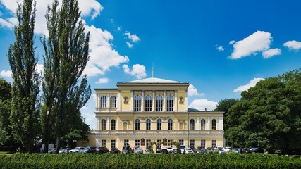 Obraz premium Zofin Palace on Slovansky Island Under a Blue Summer Sky in Prague, Czech Republic