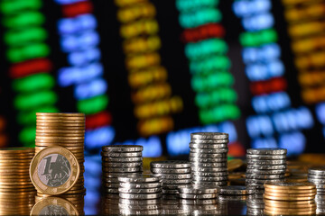 stack of currencies on a graph, concept of economic collapse, falling financial graph, falling...