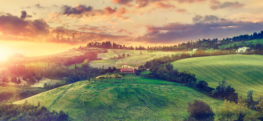 Picturesque sunset over green hills sunshine Italy dramatic sky cloud panorama landscape. Bologna. Tuscany. © Designpics