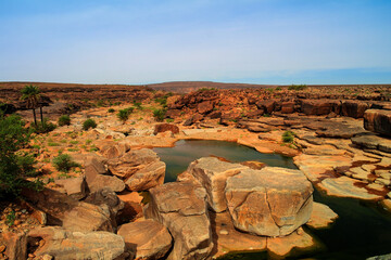 Panorama of rocky pond on Adrar plateau, Mauritania - obrazy, fototapety, plakaty
