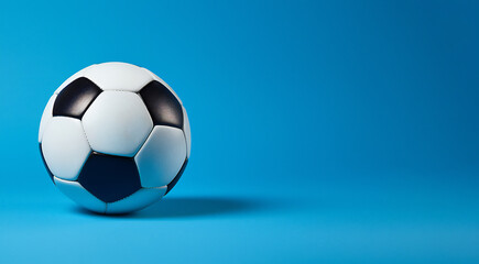 Fototapeta premium Classic Soccer Ball on light blue background. Sports Illustration. Ai generative.