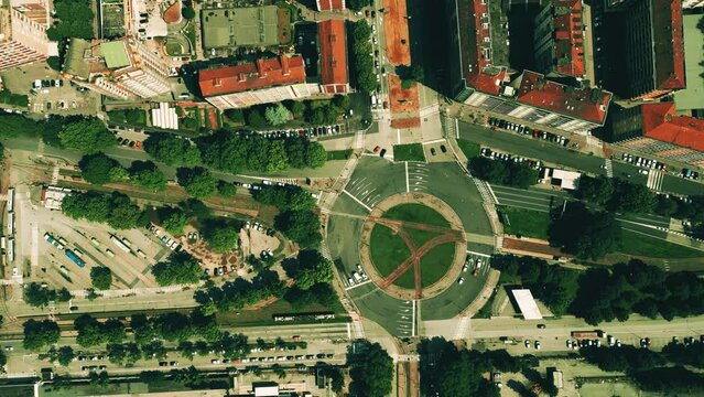 Aerial top down time lapse of busy urban streets and roundabout traffic. Turin, Italy