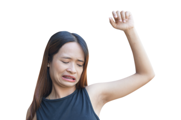 Delve into the realm of personal hygiene as a woman gazes upon her armpit, battling sweat and bad smells. A striking portrayal of self-care and confidence.