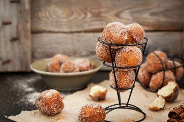 Fresh delicious homemade sour cream ball doughnuts with cinnamon sugar