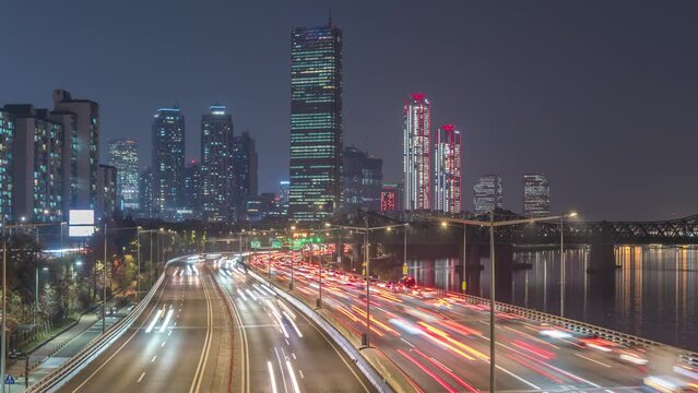Seoul South Korea time lapse 4K, city skyline night timelapse of skyscraper at Yeouido and Han River with traffic