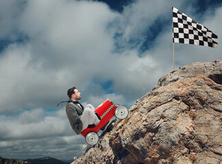 Businessman climb a mountain with a small car to get to the flag. Achievement business goal and...