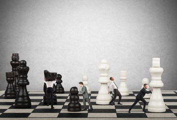 Businessmen move the chess pieces. Strategy and tactics in business concept