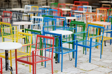 Fototapeta na wymiar Empty stylish street european cafe with colorful furniture