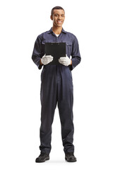 Full length portrait of an african american car mechanic holding a clipboard and smiling
