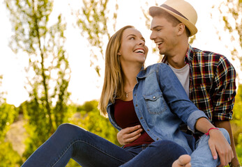 Portrait of a happy young couple enjoying a day in the park together