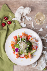 Gourmet salad with wine, top view