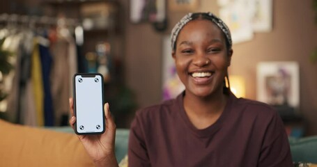 African woman creates informative video where she highlights its innovative features, such as facial recognition technology and augmented reality capabilities. - Powered by Adobe