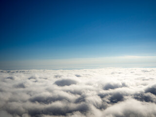 Fototapeta na wymiar Perfect sea of fog and clearly blue sky background