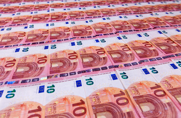 Small ten euro bills layer in low angle perspective - banking and finance concept