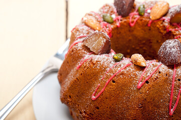 fresh chestnut cake bread dessert with almonds and pistachios on top