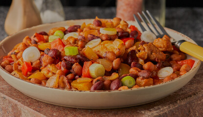 Mexican styled spicy chicken with mixed beans and vegetables.