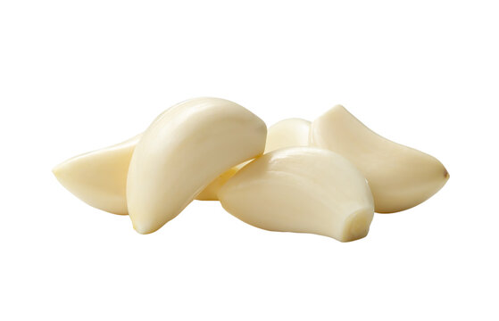 Peeled garlic cloves in stack isolated on white background with clipping path in png file format