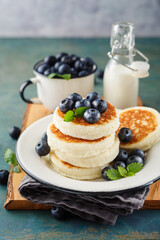 Cottage cheese pancakes with fresh blueberries and milk, Delicious Breakfast