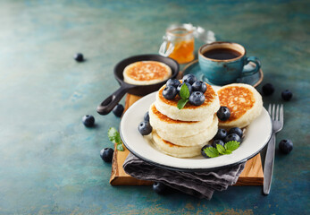 Cottage cheese pancakes with fresh blueberries and coffee, Delicious Breakfast