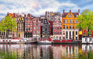 Amsterdam Netherlands dancing houses over river Amstel landmark in old european city spring landscape.