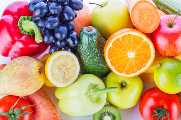 Assortment of exotic fruits and vegetables on white background