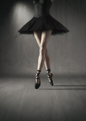 Obraz na płótnie Canvas Close up to a ballerina legs with black tutu. This is a 3d render