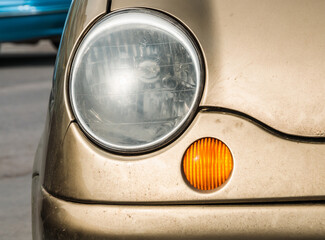 Detail of old car headlight. transport and city