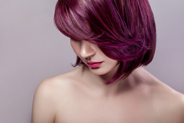 Side view portrait of calm beautiful attractive fashion model woman with short purple colored...