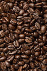 Abstract roasted coffee beans background. Macro photo