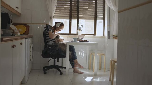 Home office, woman doing work at home using laptop