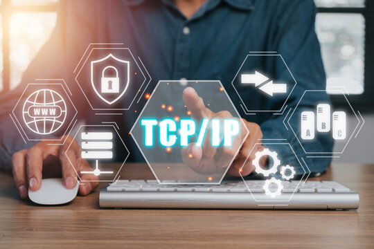 TCP IP, Network data transmission model concept, Person hand using computer and hand touching tcp ip icon on virtual screen.