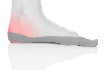 Therapeutic tape on female heel isolated on white background. Chronic pain, alternative medicine. Rehabilitation and physiotherapy.