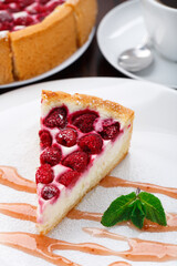 Delicious cheesecake with raspberries on a plate