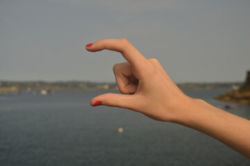 hand making size gesture, outdoors