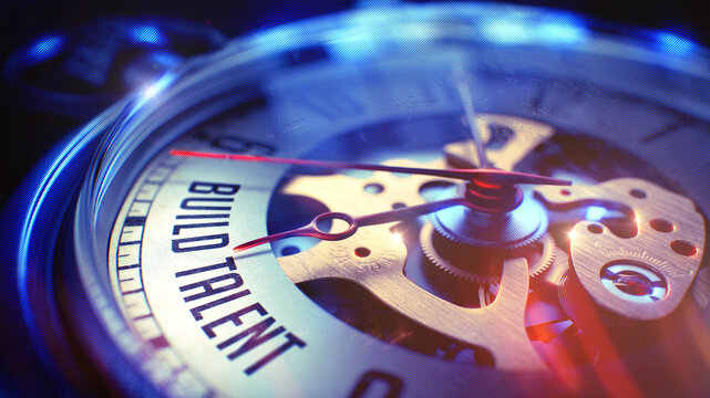 Business Concept: Build Talent Wording. on Pocket Watch Face with Close View of Watch Mechanism. Time Concept with Selective Focus and Light Leaks Effect. 3D Illustration.