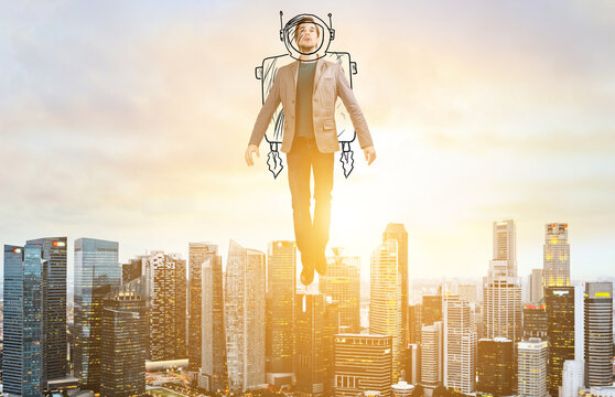 Business Advantage. Businessman in sketch astronaut costume hovering over down town on sunset.