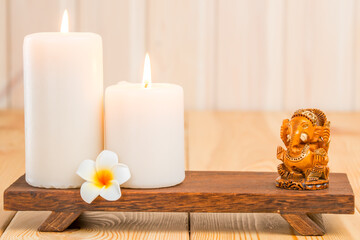 statue of the Hindu god Ganesha and religious candles