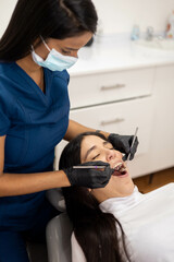 dental treatment a young female patient, working day and healthcare professional occupation, dentist lifestyle, medicine and oral health in office interior