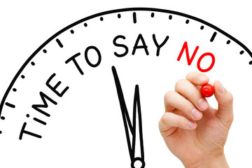 Hand writing Time To Say No on a clock with marker on transparent wipe board.