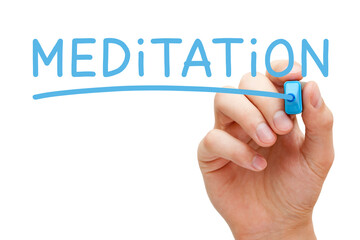 Hand writing Meditation with blue marker on transparent wipe board.