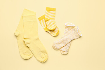 Set of cotton socks on color background